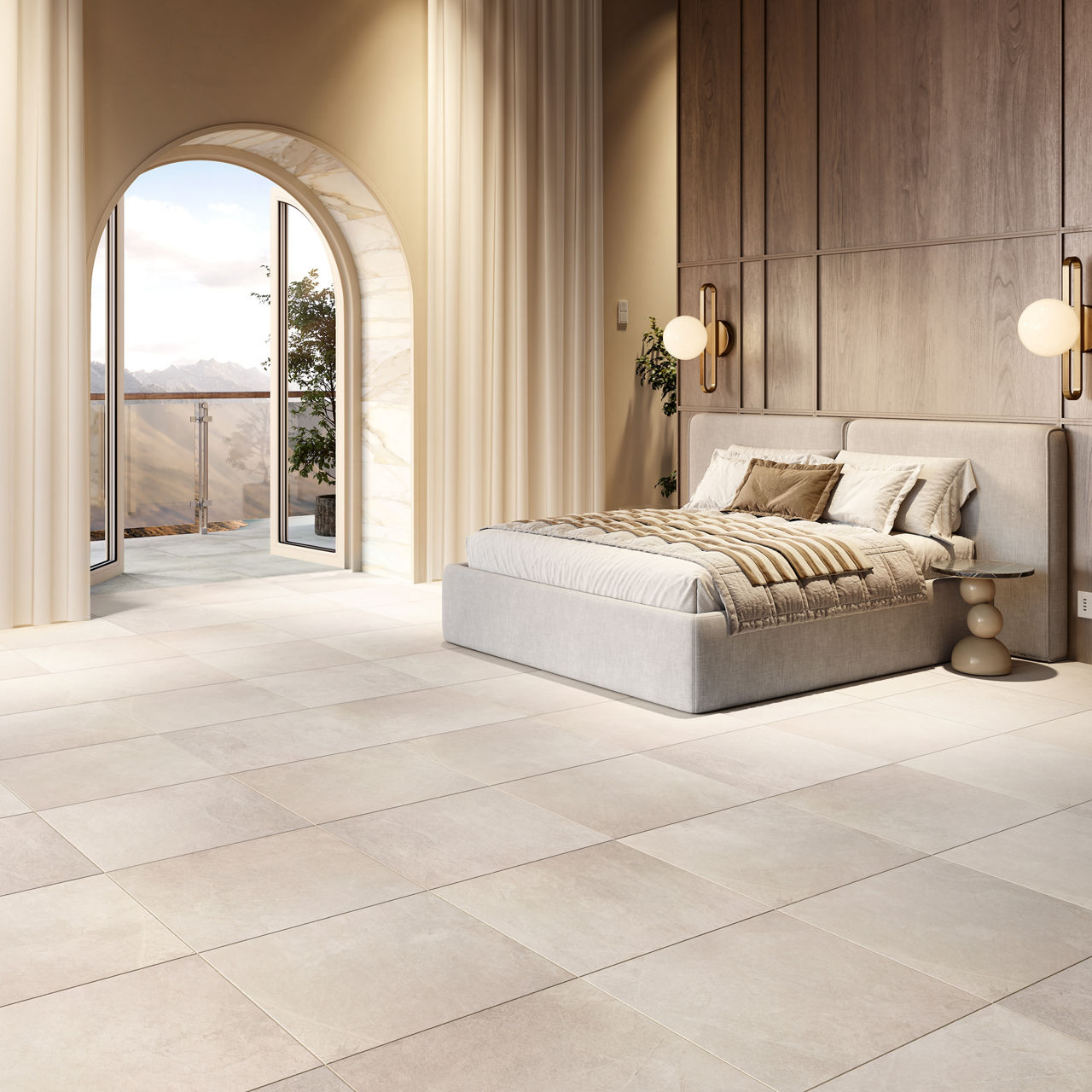 Bedroom with beige concrete look square floor tile, beige bed, beige walls, and arched window showing mountain view.