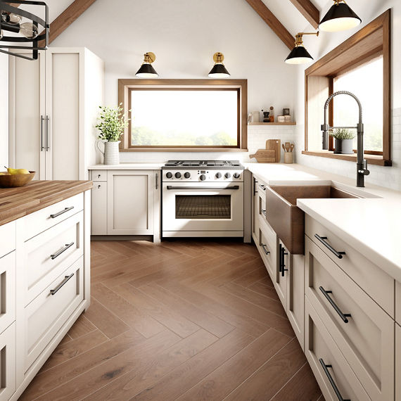 Kitchen with farmer sink, white cabinets, wooden accents, and wood floors.