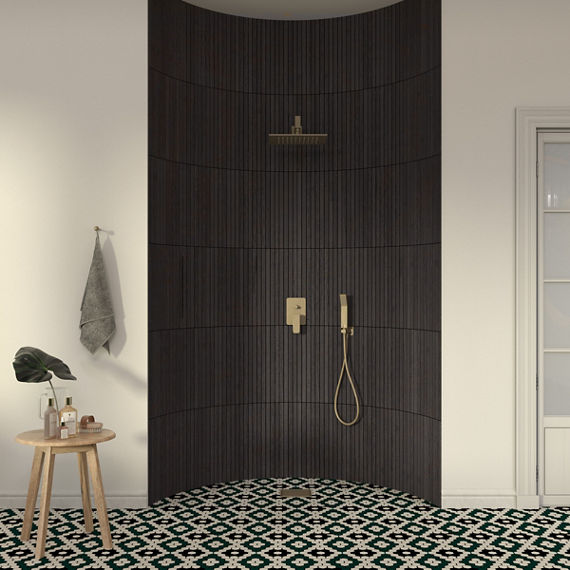 Bathroom with rounded shower, wood look rectangle mosaic on shower walls, mosaic pattern on shower floors, and white outer walls.