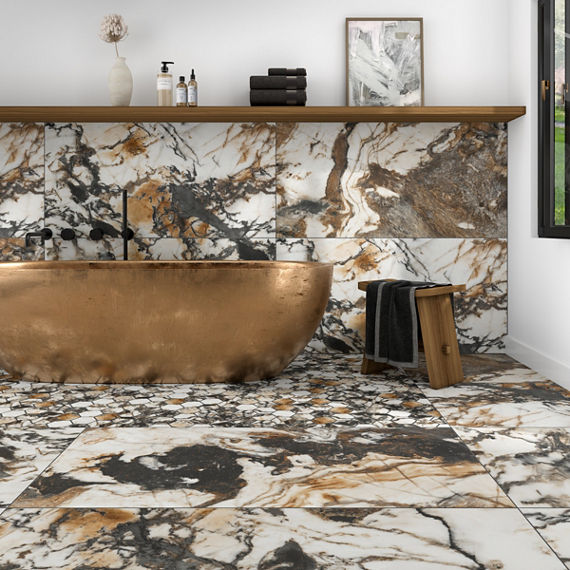 Close up of bathtub with marble look rectangle tile with brown and black veining on floor and bottom half of back wall, copper bathtub, floating wood shelf, and small wooden stool.