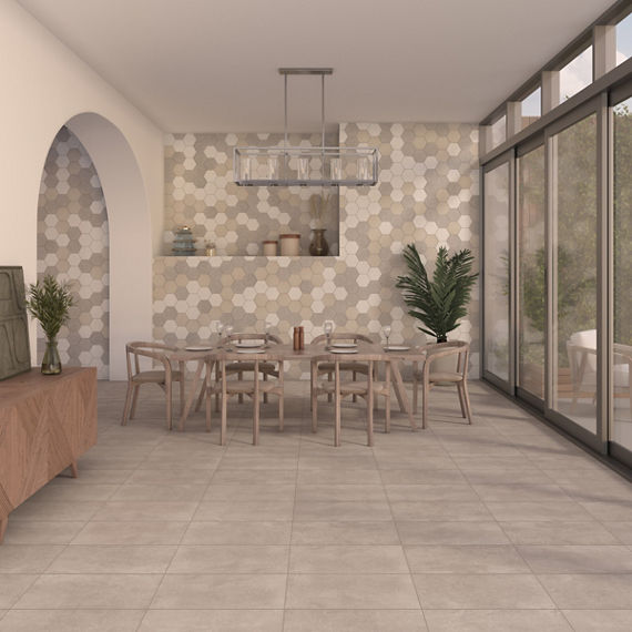Kitchen with light beige rectangle stone look floor tile, small beige dining table and matching chairs, white wall with arch entry on the side, and beige hexagon wall tile on back wall.