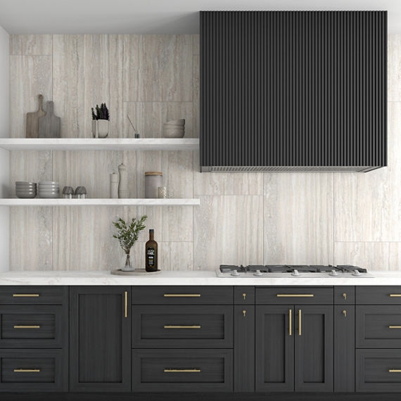 Kitchen with black cabinets, white countertop, white floating shelves, and white stone look rectangle tile on backsplash.