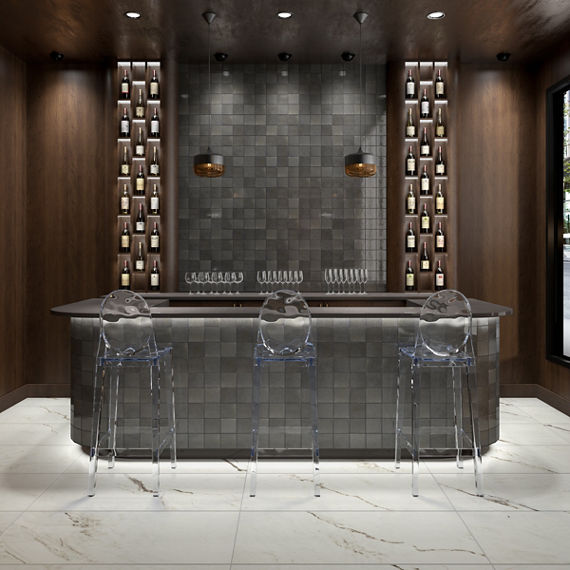 Bar with clear bar chairs, dark wood walls, and square gray wall tile on back and back wall.