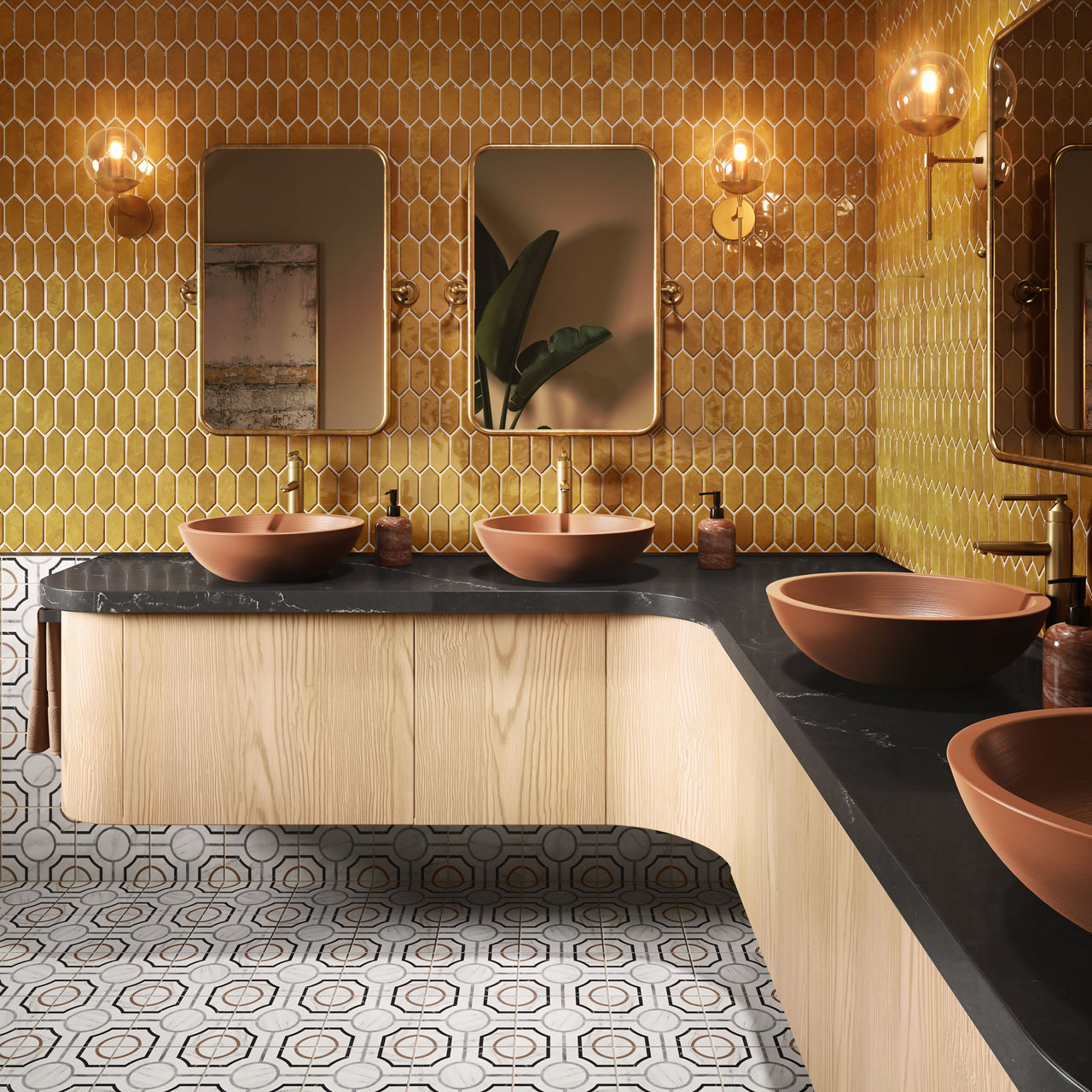 Bathroom with yellow picket wall tile, light wood cabinets, black marble look countertop, round orange sinks, and white encaustic floor tile.