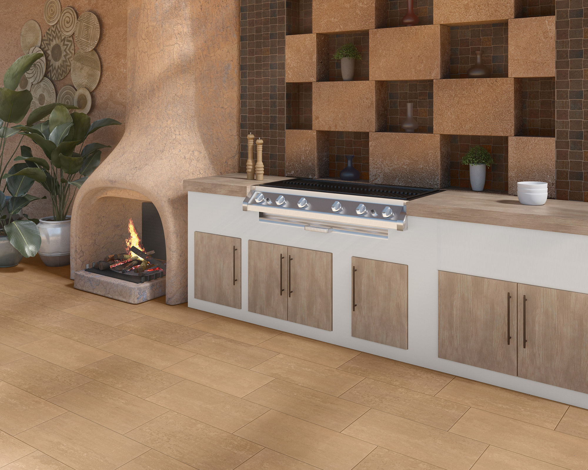Outdoor kitchen with built-in grill, white countertop, wooden cabinets, and a corner fireplace with a fire burning. Decorative shelving with pottery and plants in the background.