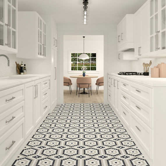 Kitchen with white cabinets, penny round mosaic patter on floor, and white walls.