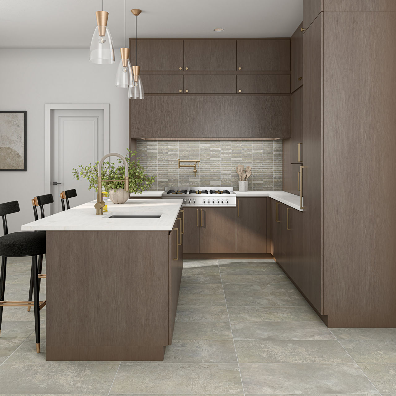 Kitchen with brown cabinets, white countertops, gray stone look floors, and gold accents.