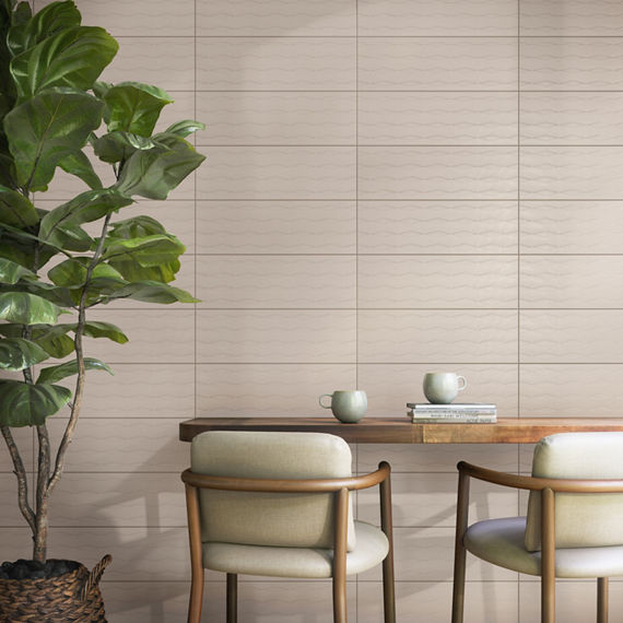 Dining room with beige rectangle tile with diamond pattern on back wall, wood table, wood chairs, and plant on side.