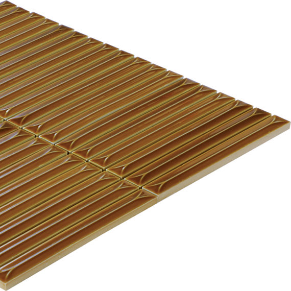 The image shows a rectangular gold metallic slatted panel viewed in perspective against a white background. Parallel ridges run across the surface, creating a repeating geometric pattern. The panel appears clean and modern, with reflective highlights