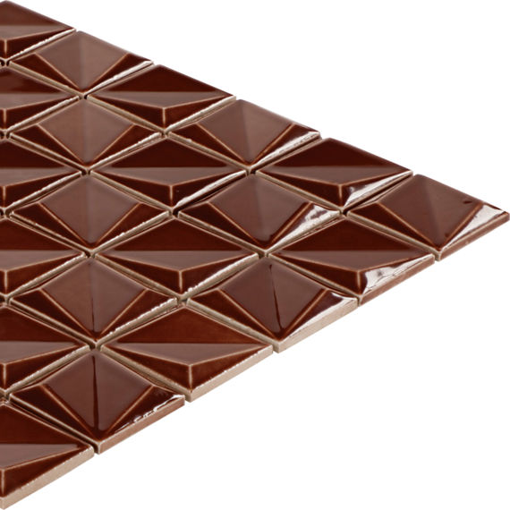 A square sheet of glossy brown tiles is arranged in a repeating geometric pattern. Each tile features a raised, pyramid-like 3D surface that creates a faceted look. The tiles are shown isolated on a white background, emphasizing their reflective fini