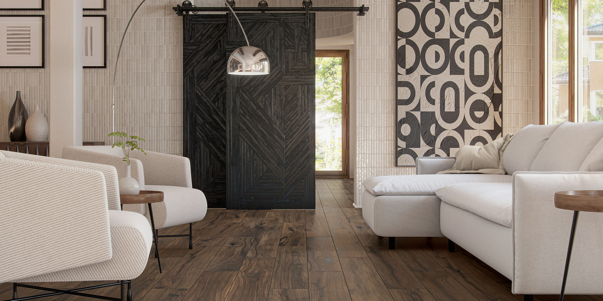 A contemporary living room features warm rustic wood plank flooring and neutral upholstered sofas. Large abstract artwork and framed prints decorate the walls, adding graphic interest to the space. Exposed wooden ceiling beams and a dark sliding barn