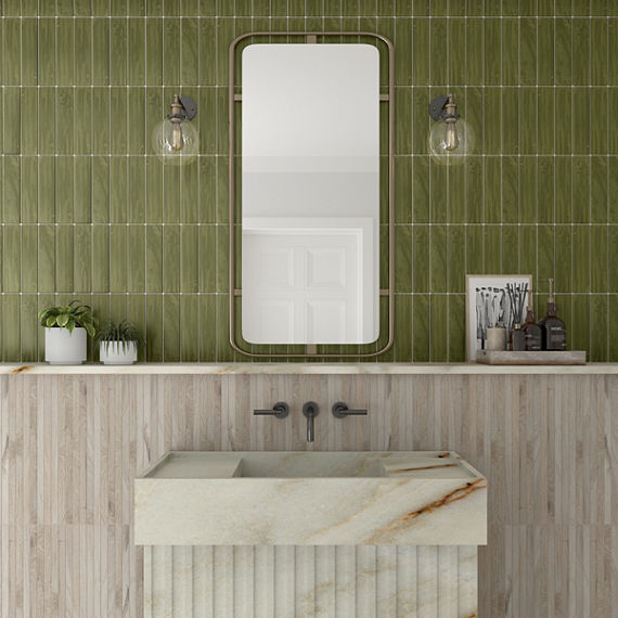 Bathroom with green rectangle tile on top half of wall in vertical pattern, light wood look rectangle mosaic on bottom half of wall, white marble look sink, and rectangle mirror above sink.