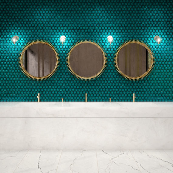 Bathroom with three sinks, white countertop, and a blue pyramid hexagon mosaic on the back wall.