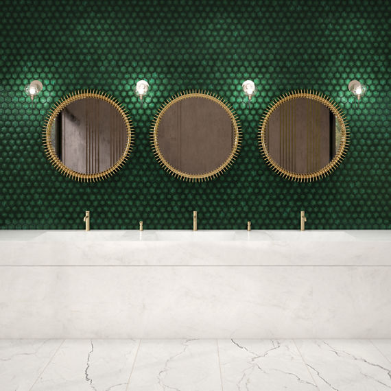 Bathroom with three sinks, white countertop, and a green pyramid hexagon mosaic on the back wall.