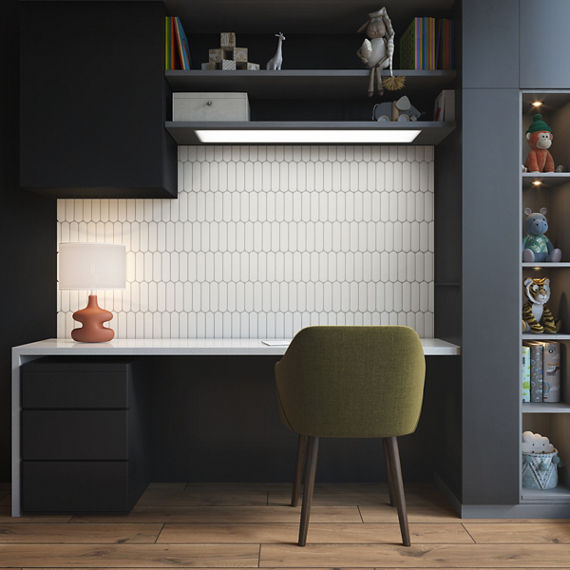 Desk with white capsule tile on back wall, black shelves, green chair, and orange lamp.