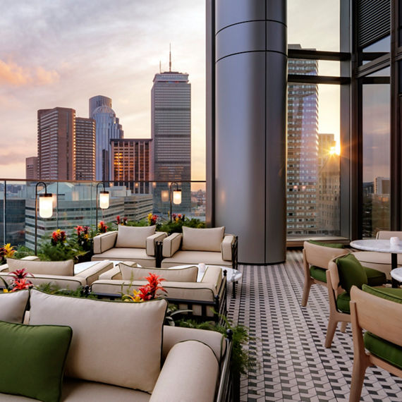 Rooftop with white concrete look porcelain slab floor tile custom cut into mosaic, black metal look porcelain slab floor tile custom cut into mosaic, and showing the Boston Skyline in back.