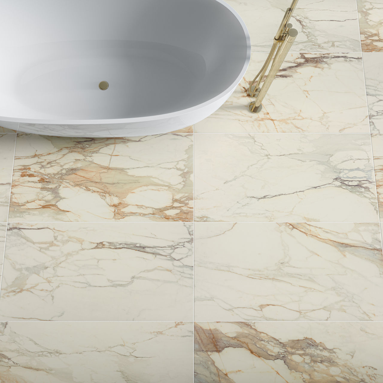 Bathroom scene with large-format rectangular warm beige marble-look 24x48 tile, matte finish, golden and brown veining, and a white freestanding tub.