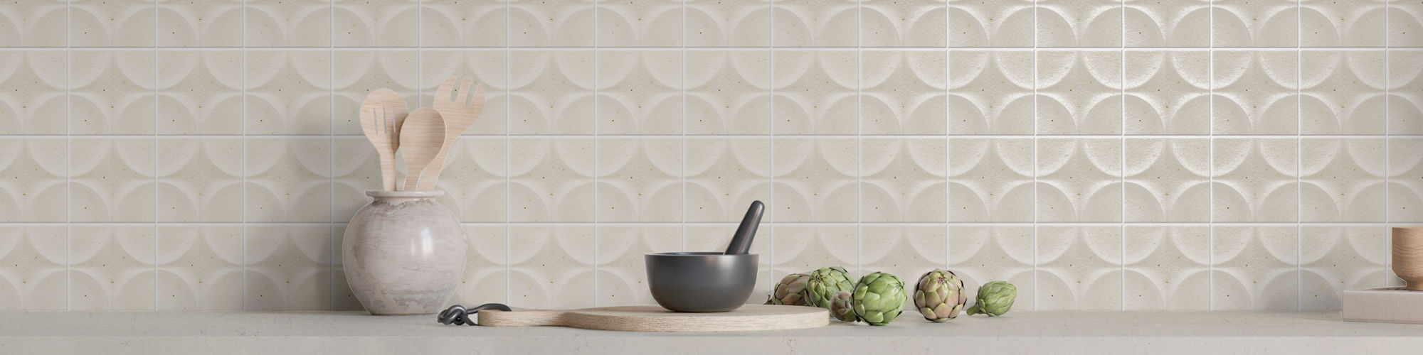 Kitchen with white square wall tile with star design on backsplash, gray cabinets, white countertop, and dishes on counter.