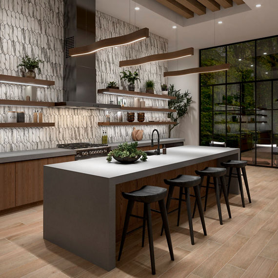 Open concept kitchen with gray countertops and marble picket backsplash. 