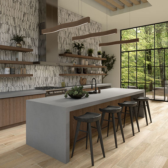 Open concept kitchen with gray countertops and marble picket backsplash. 