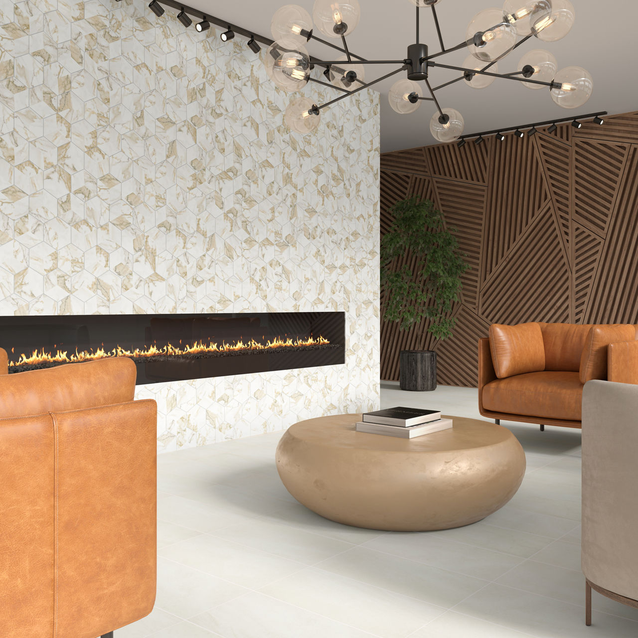 A contemporary lounge features tan leather armchairs arranged around a round beige coffee table. The focal point is a long, horizontal fireplace set into a white wall with a gold geometric tile pattern. The space is accented by a modern chandelier, w