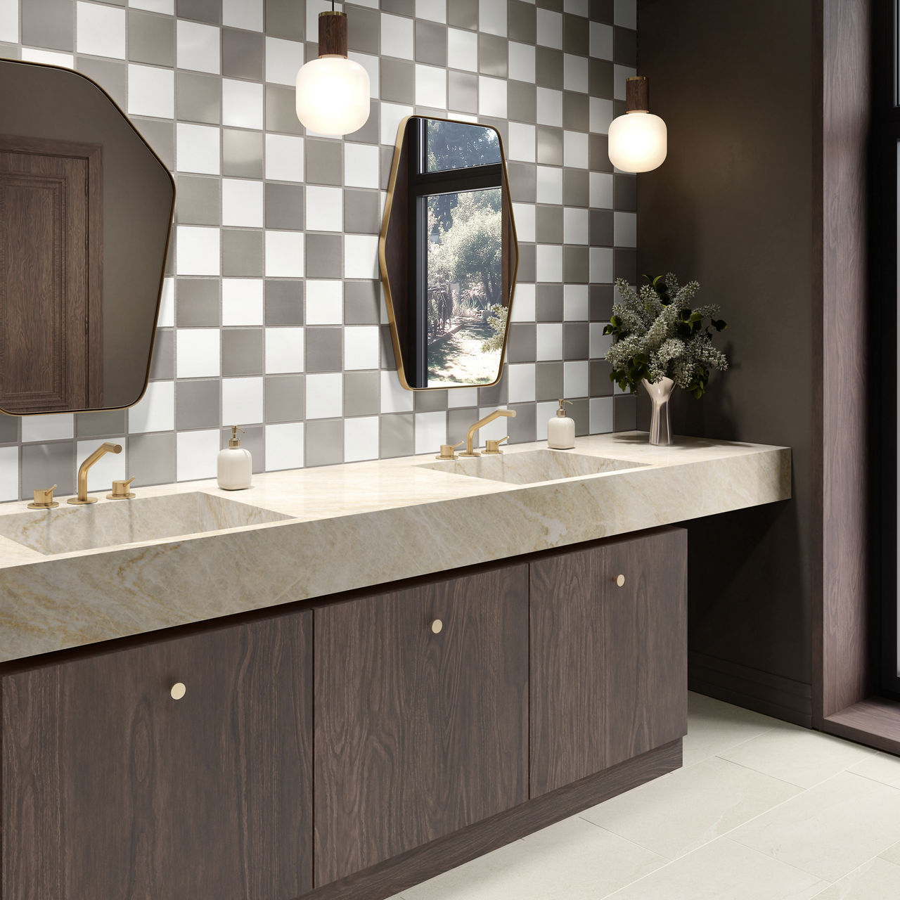 Bathroom with white and gray square wall tile on back wall, wooden cabinets and side wall, beige quartz counter, and gold accents.