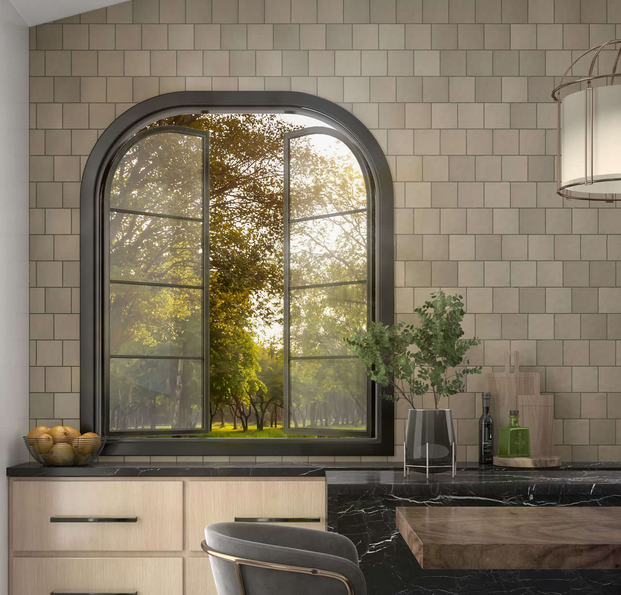 Kitchen window showing greenery outside, light gray square mosaic tile on walls, black countertop, and light wood cabinets.