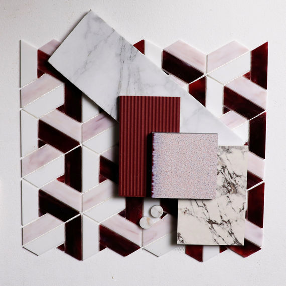 Flatlay with a pink pinwheel mosaic, white marble look rectangle tile, red ridged rectangle tile, and a white marble look slab.