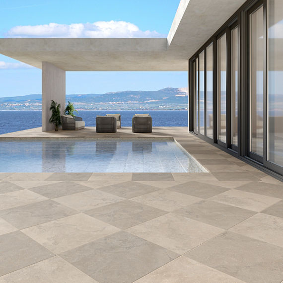 Pool side with light gray stone look pavers.