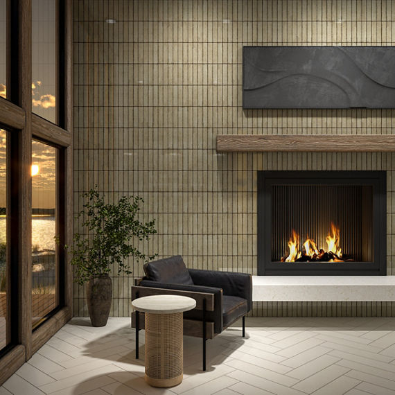 Living room with champagne metallic look subway tile on back wall, white rectangle floor tile in herringbone pattern, black sitting chair, and a lit fireplace.