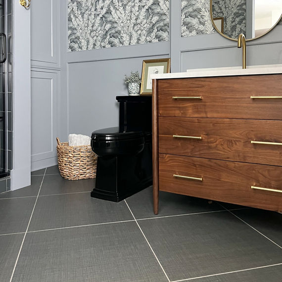 Basement bathroom with gray fabric look square tile on floor, 