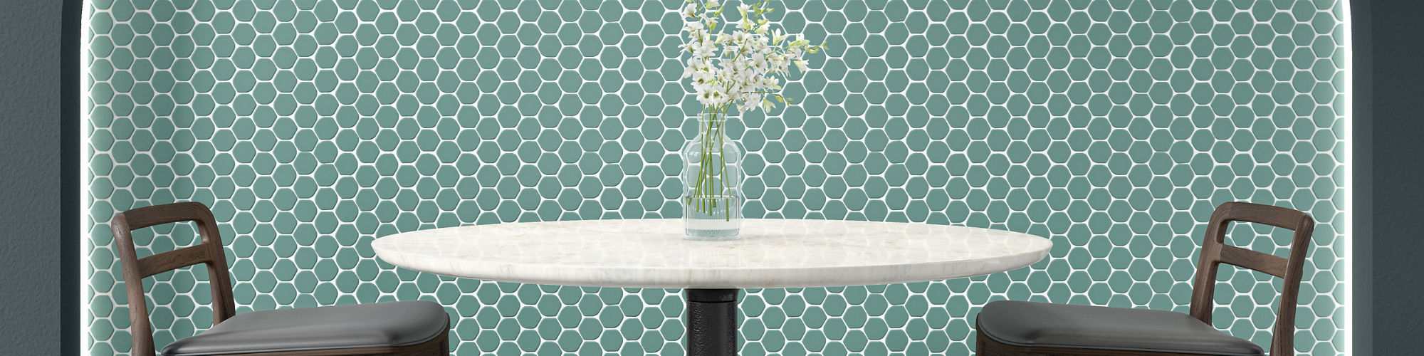 Cafe with blue hexagon mosaic tile in arch, blue walls, tall white round table, and two tall chairs.