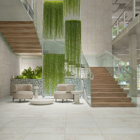Sitting area with white concrete look rectangle floor tile, white decorative look rectangle tile on wall with Japanese influence, wooden stairs, and vines hanging in the center of the room.