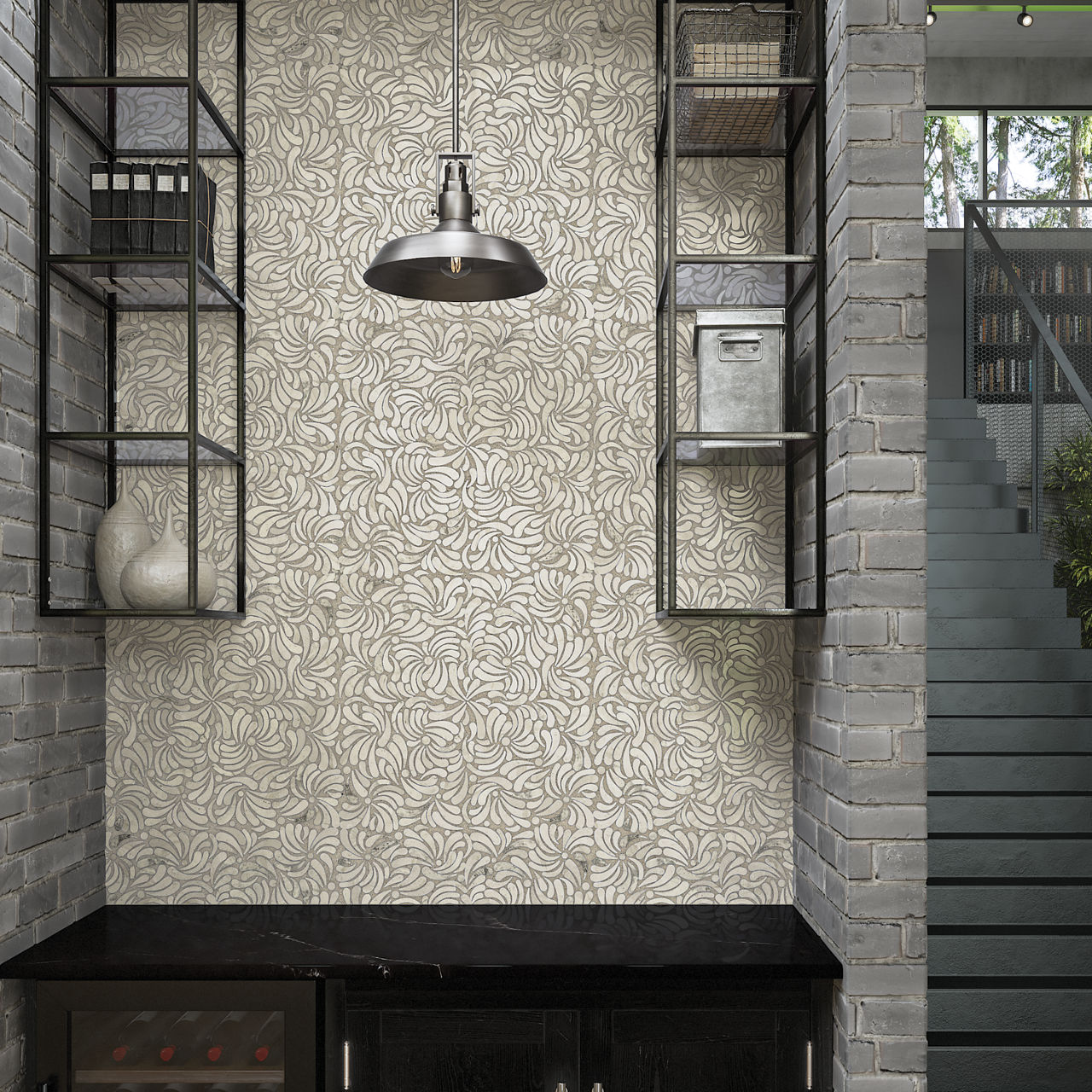 A modern interior nook features a decorative wall covered in light patterned tiles framed by gray brick. Black metal shelving units flank the tiled area, holding minimalist decor objects and storage boxes. A metallic pendant light hangs centrally abo