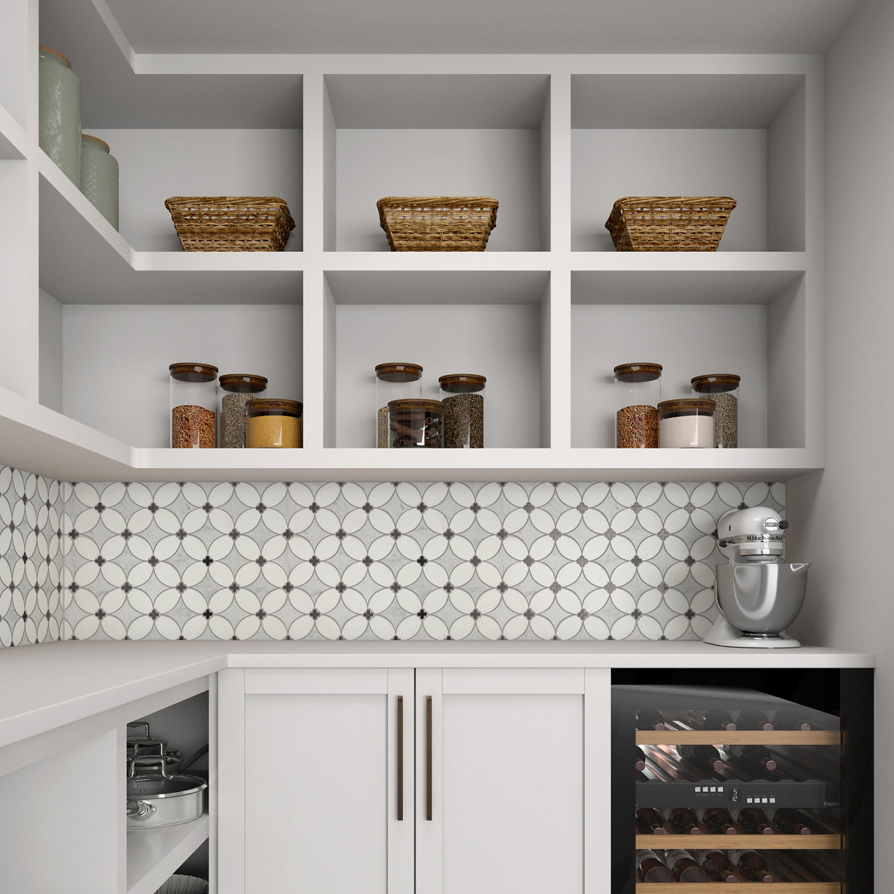 A contemporary pantry features white cabinetry with open shelves displaying woven baskets and glass jars of dry goods. The backsplash is covered in circular white and gray tiles, adding a geometric accent to the space. A built-in wine refrigerator is