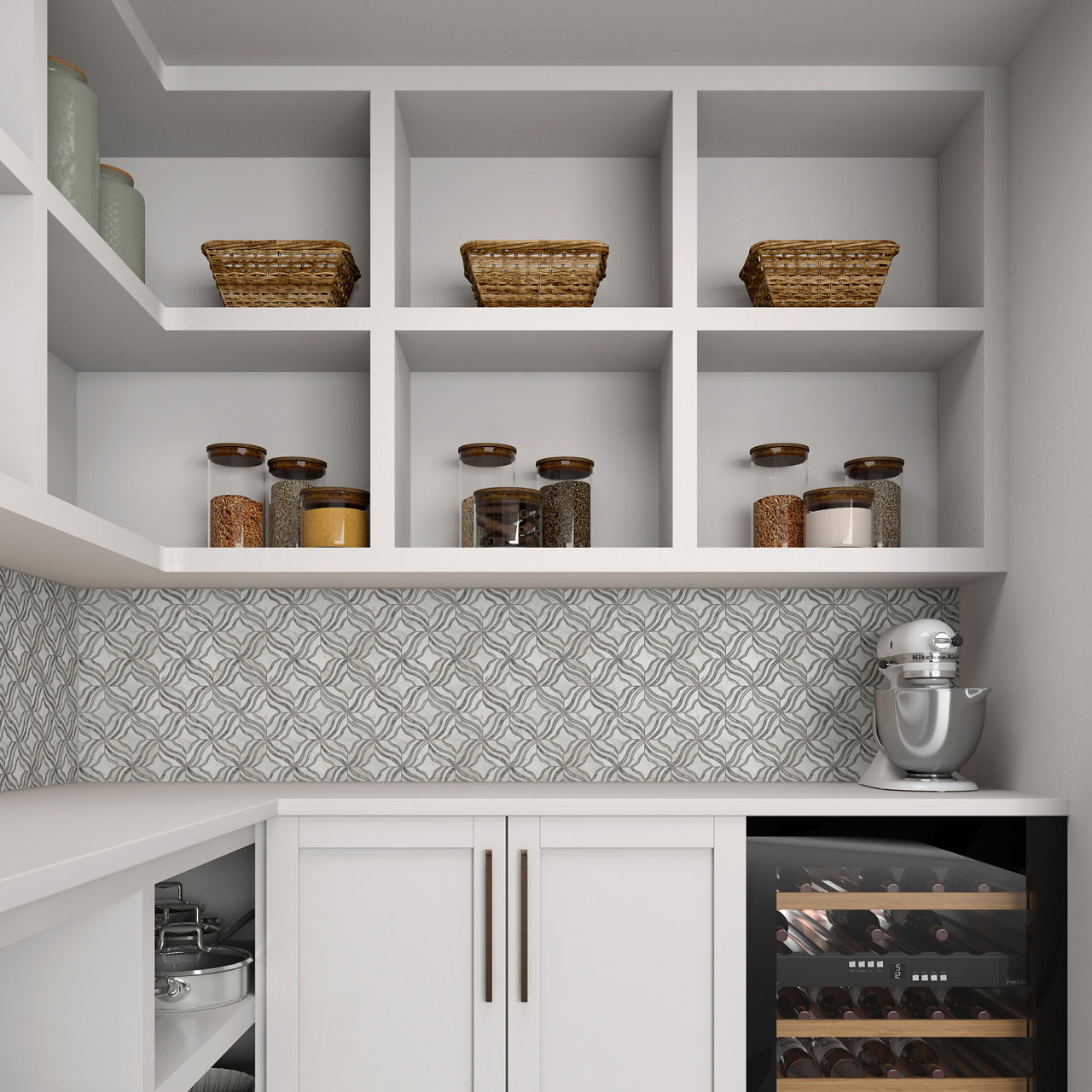 A contemporary pantry features white cabinetry with open shelves displaying baskets and glass jars of dry goods. The backsplash has a geometric patterned tile that adds visual interest to the neutral space. A stainless steel stand mixer sits on the c
