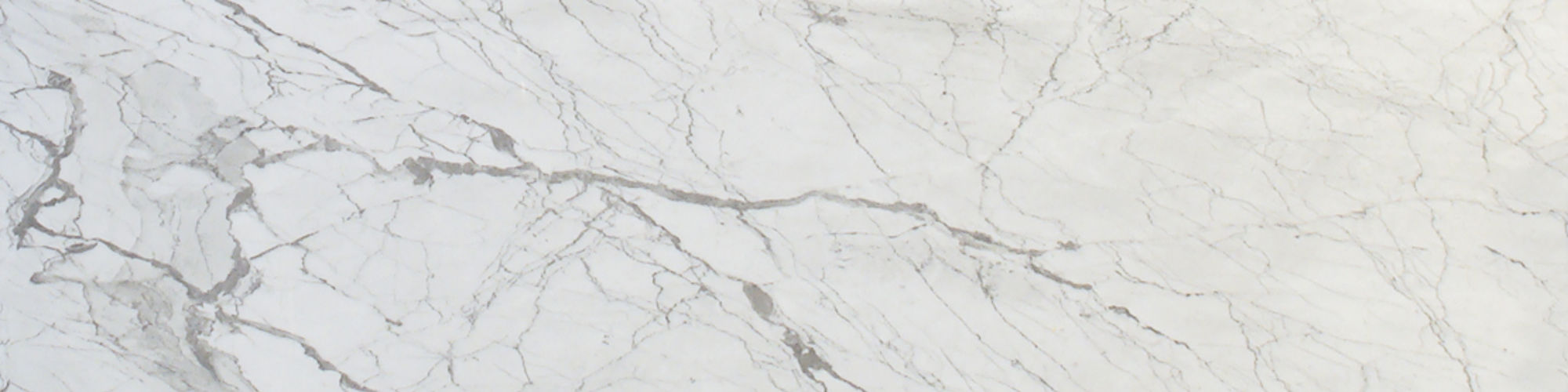 Carrara marble slab - light gray with medium gray, dark gray, tan, and brown veining