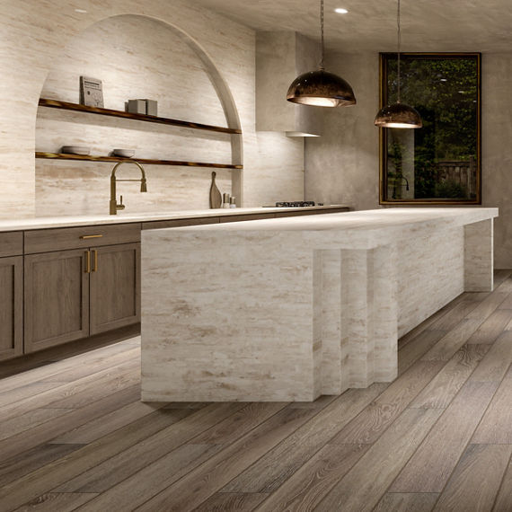 Kitchen with wooden cabinets, wood floors, beige stone look quartz island, countertop, and backsplash. 
