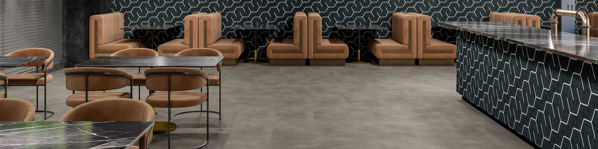 A contemporary lounge features tan upholstered chairs and marble-topped tables arranged around a geometric-patterned bar.