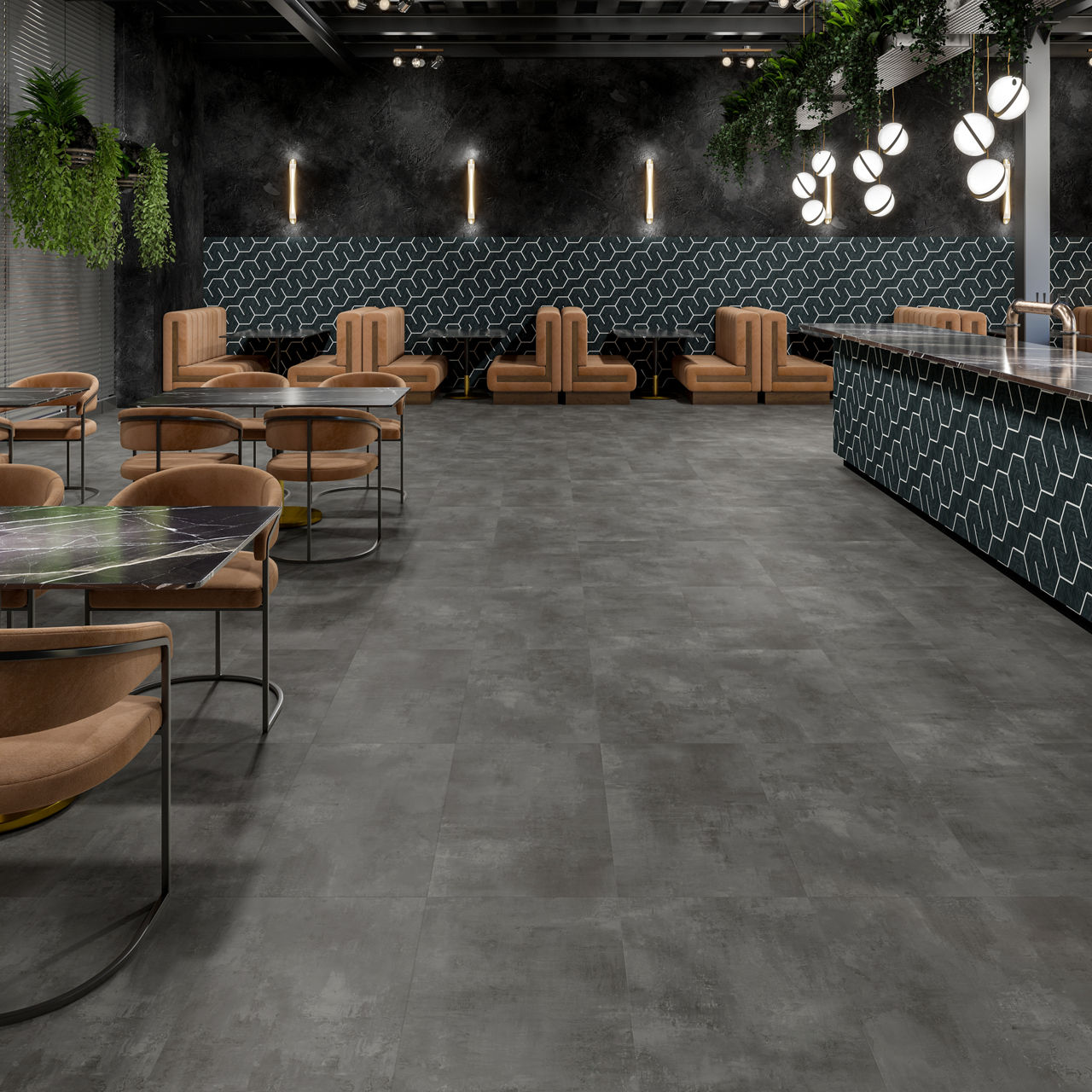 A contemporary lounge area features tan upholstered chairs and marble-topped tables arranged on a gray concrete floor.