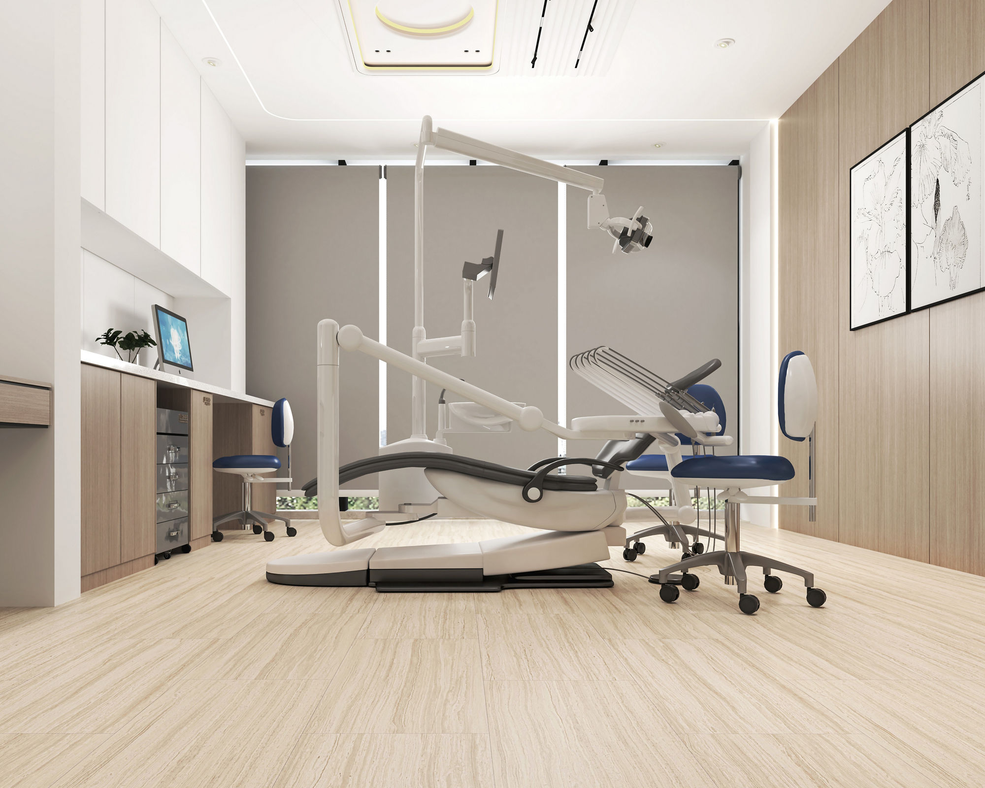 Dentists office with light wood floor tile, gray back wall, white cabinets, and white dentist chair in the middle.
