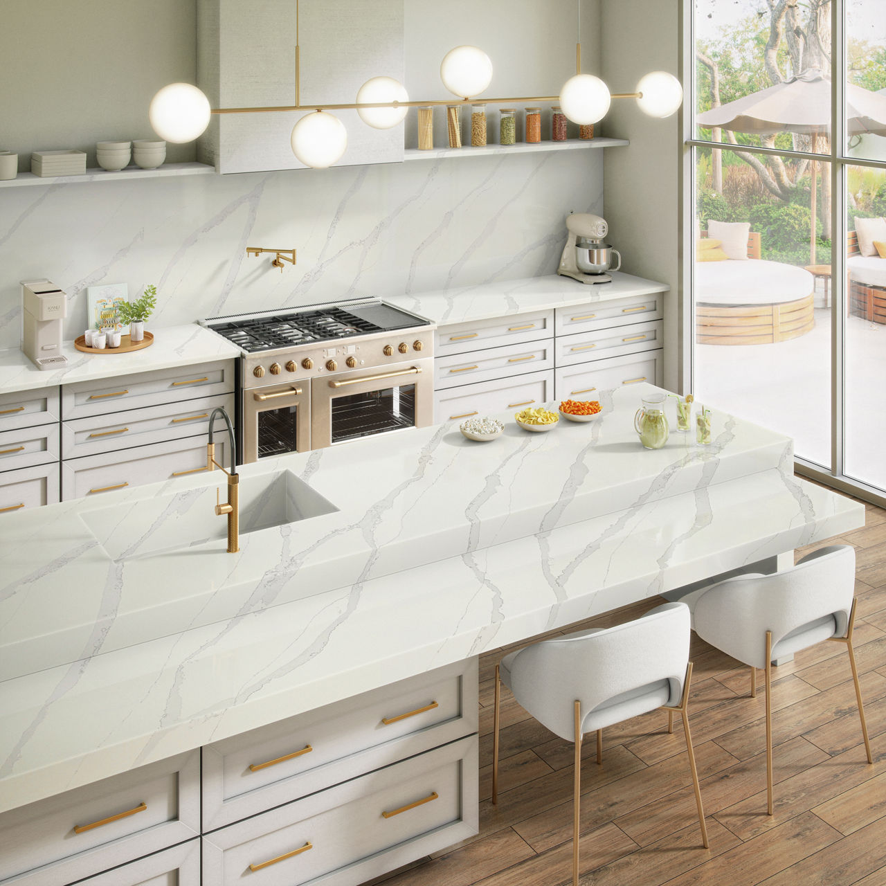 Kitchen with white marble look countertop and backsplash, white cabinets, and white chairs at kitchen island.