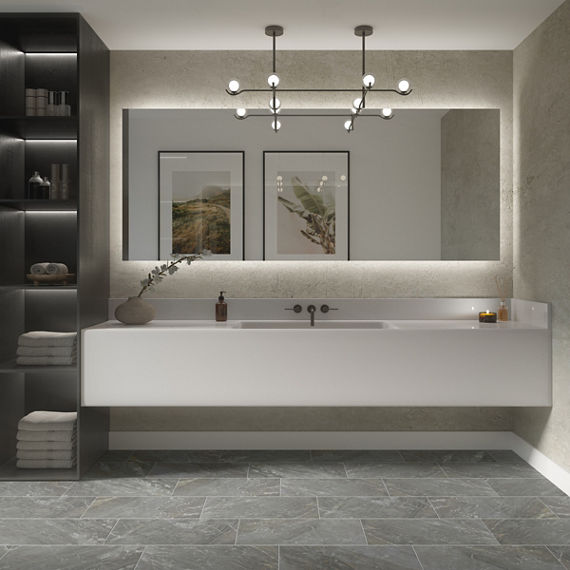 Bathroom with gray stone look rectangle floor tile, white quartz counter, white walls, and black accents.