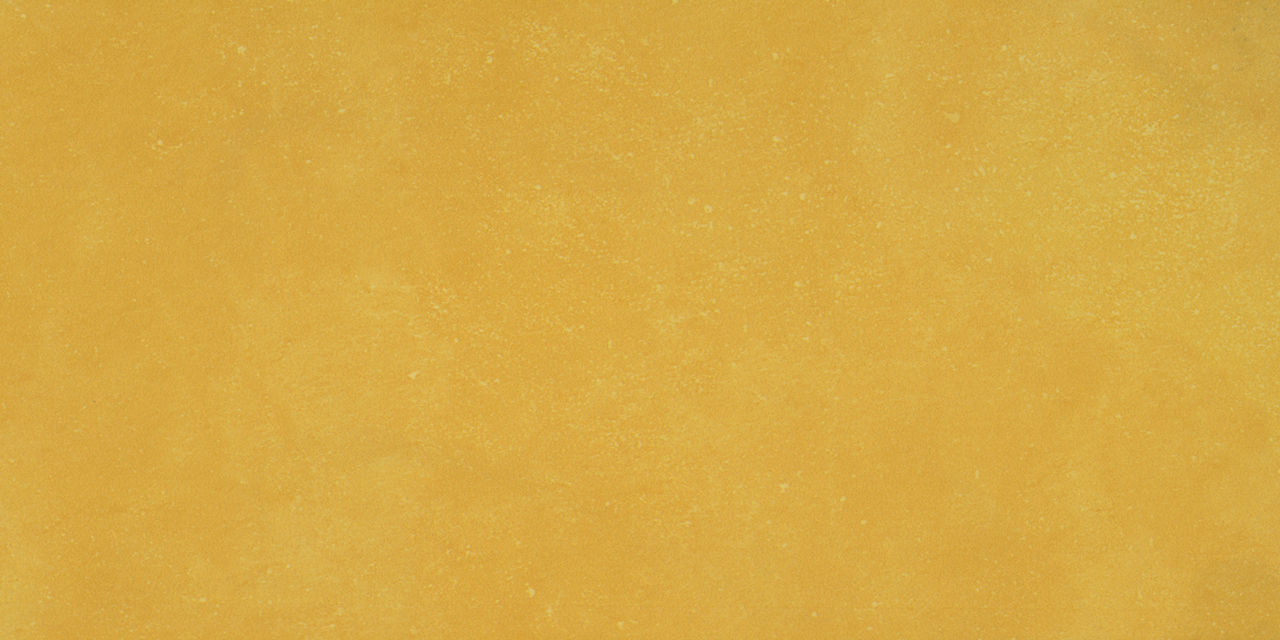 Bright yellow textured rectangle tile.