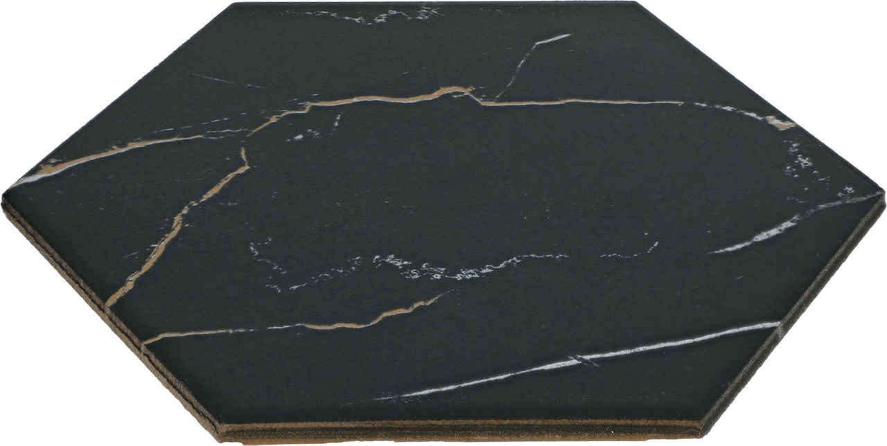 A single hexagonal tile is shown with a black marble finish and striking gold and white veining. The tile is photographed against a plain background, highlighting its geometric shape and luxurious stone texture. The surface has a matte appearance, su
