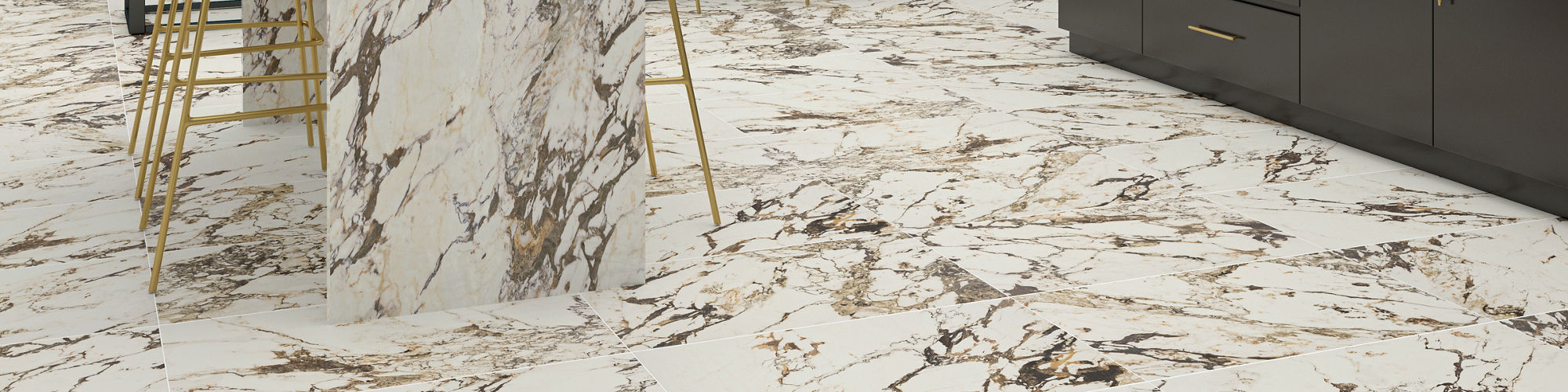 Sports stadium lounge with white marble look counter, floor, and back wall, black cabinets, and beige chairs.