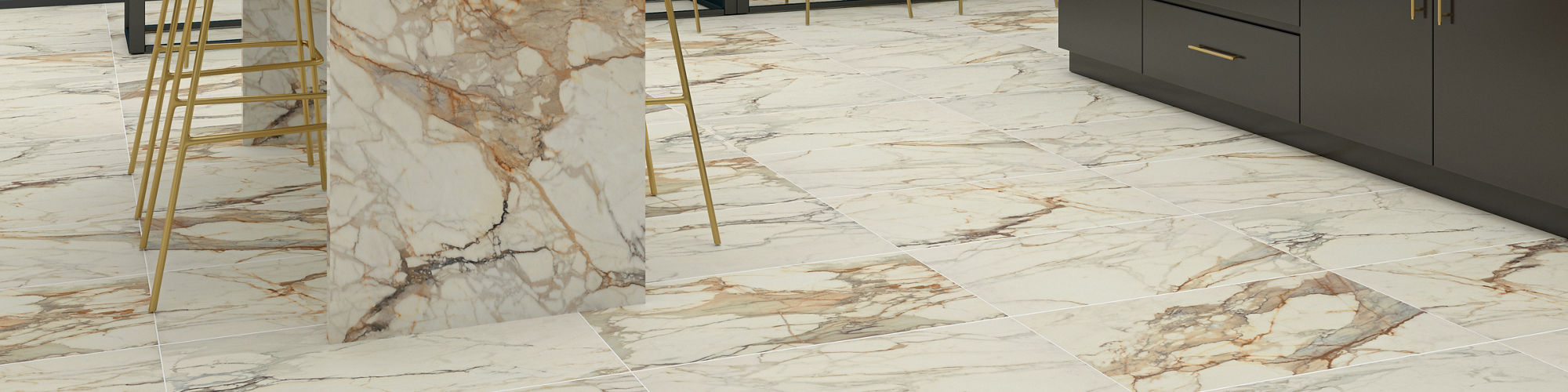 Sports stadium lounge with white marble look counter, floor, and back wall, black cabinets, and beige chairs.