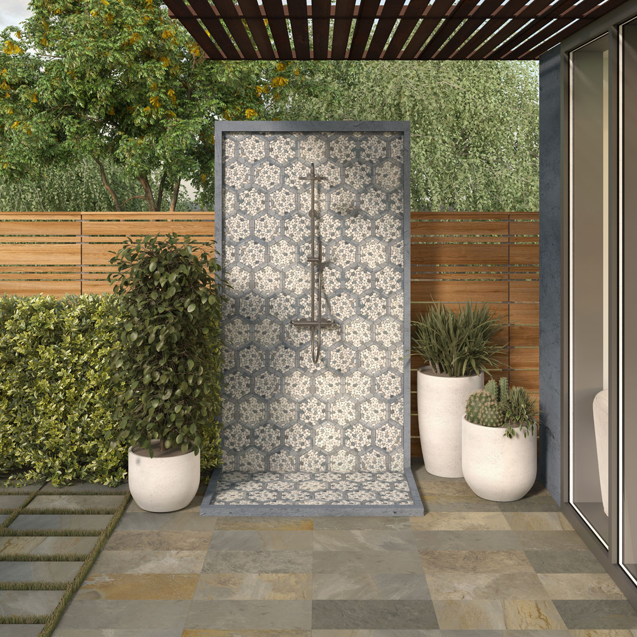 Outdoor shower with pebble mosaic pattern in the shape of hexagons surrounded by a high color variation porcelain paver.