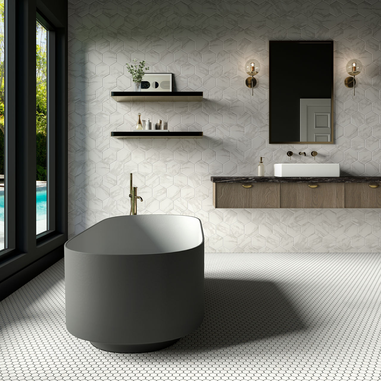 Contemporary bathroom interior featuring a large matte gray freestanding bathtub as the focal point. A wall-mounted vanity with a white vessel sink and brass fixtures sits beneath a rectangular mirror and two wall sconces. Floating shelves hold decor