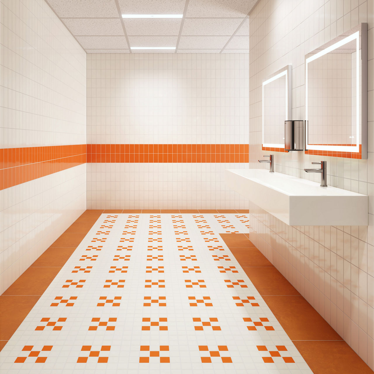 A contemporary public restroom features a geometric orange and white tile pattern on the floor and walls. The space includes a double sink with wall-mounted mirrors and a soap dispenser. The ceiling is fitted with recessed lighting, creating a bright